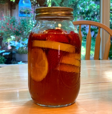 Water Kefir in Secondary Ferment (Strawberry and Orange flavored)